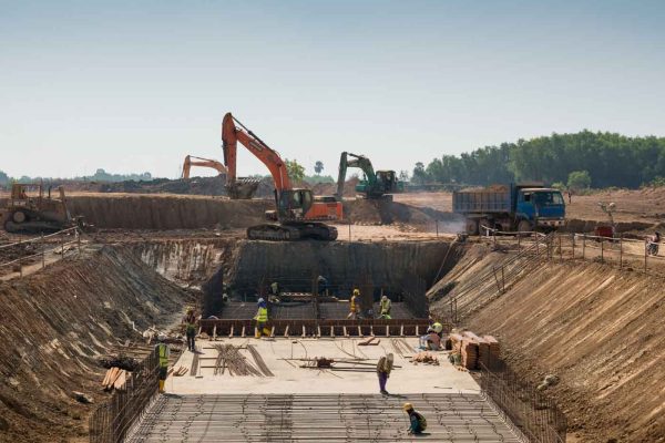 heavy-machines-construction-workers-working-building